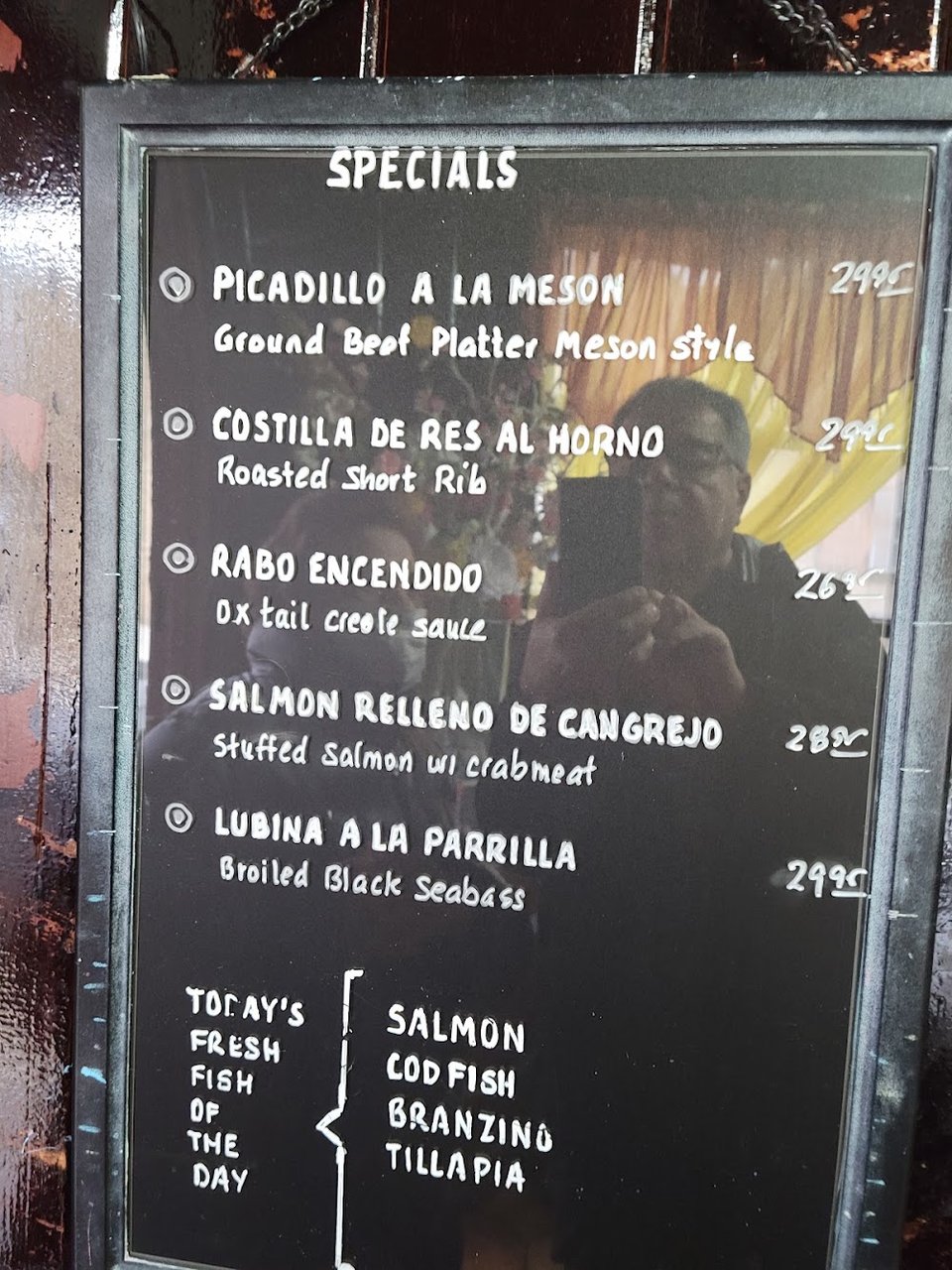 Menu page showing Spanish classics and cocktails.