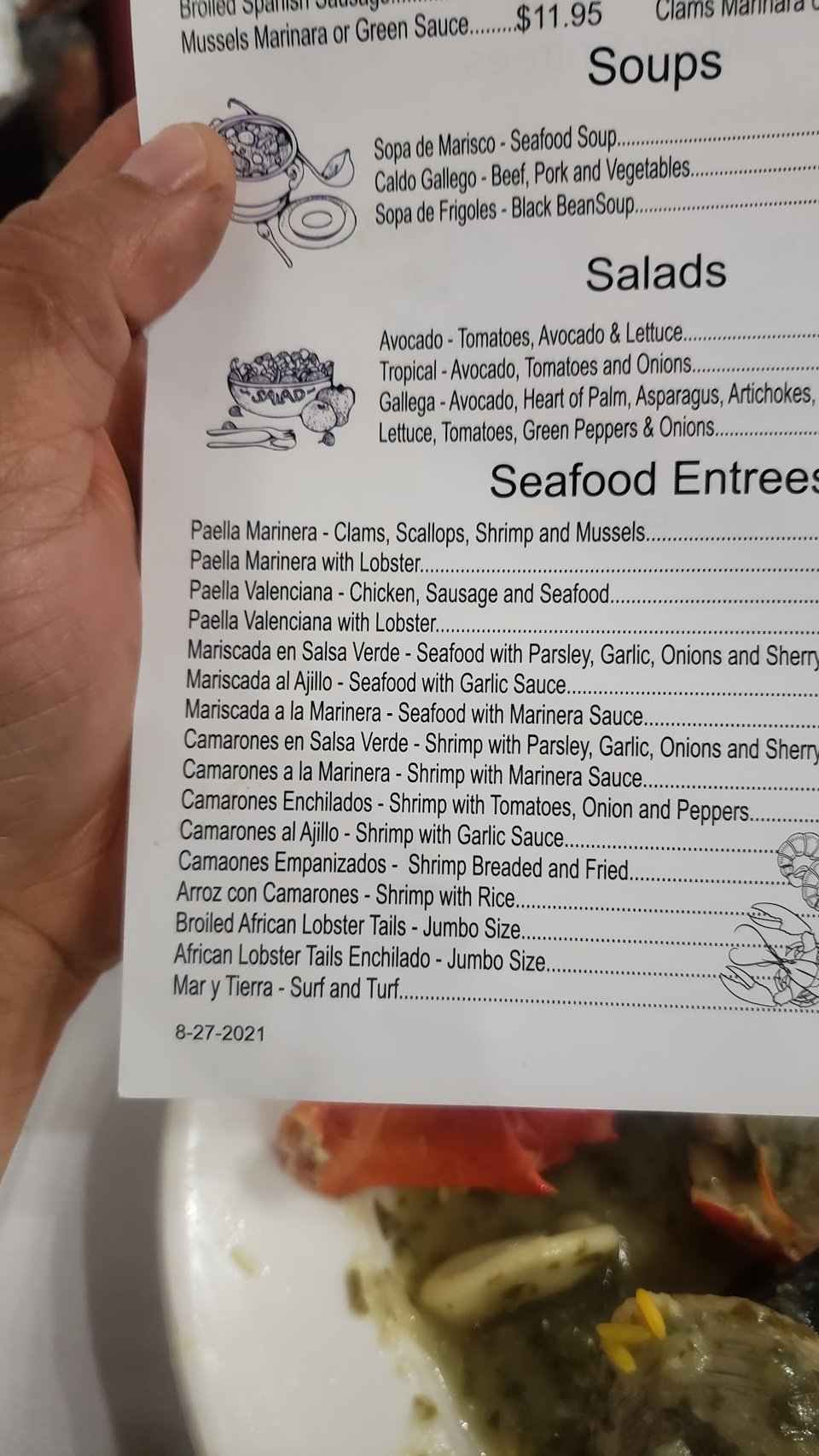 Printed menu with wine, seafood, and meat dishes.