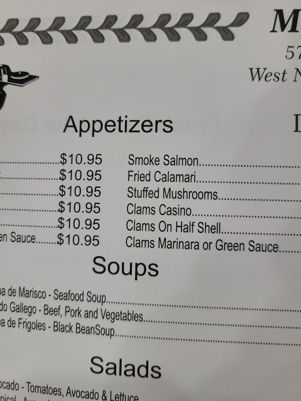 Restaurant menu featuring appetizers, soups, and salads.